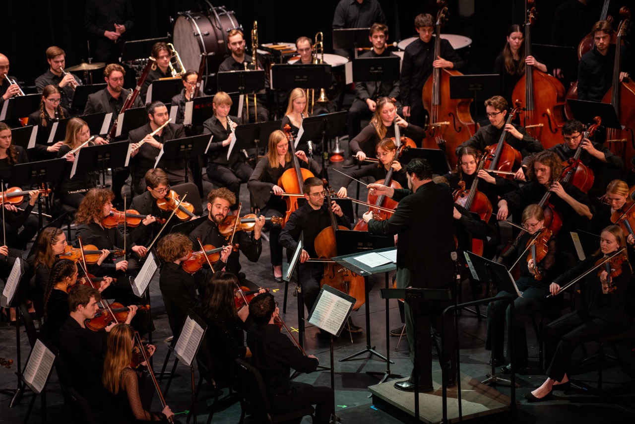 orchestra playing on stage