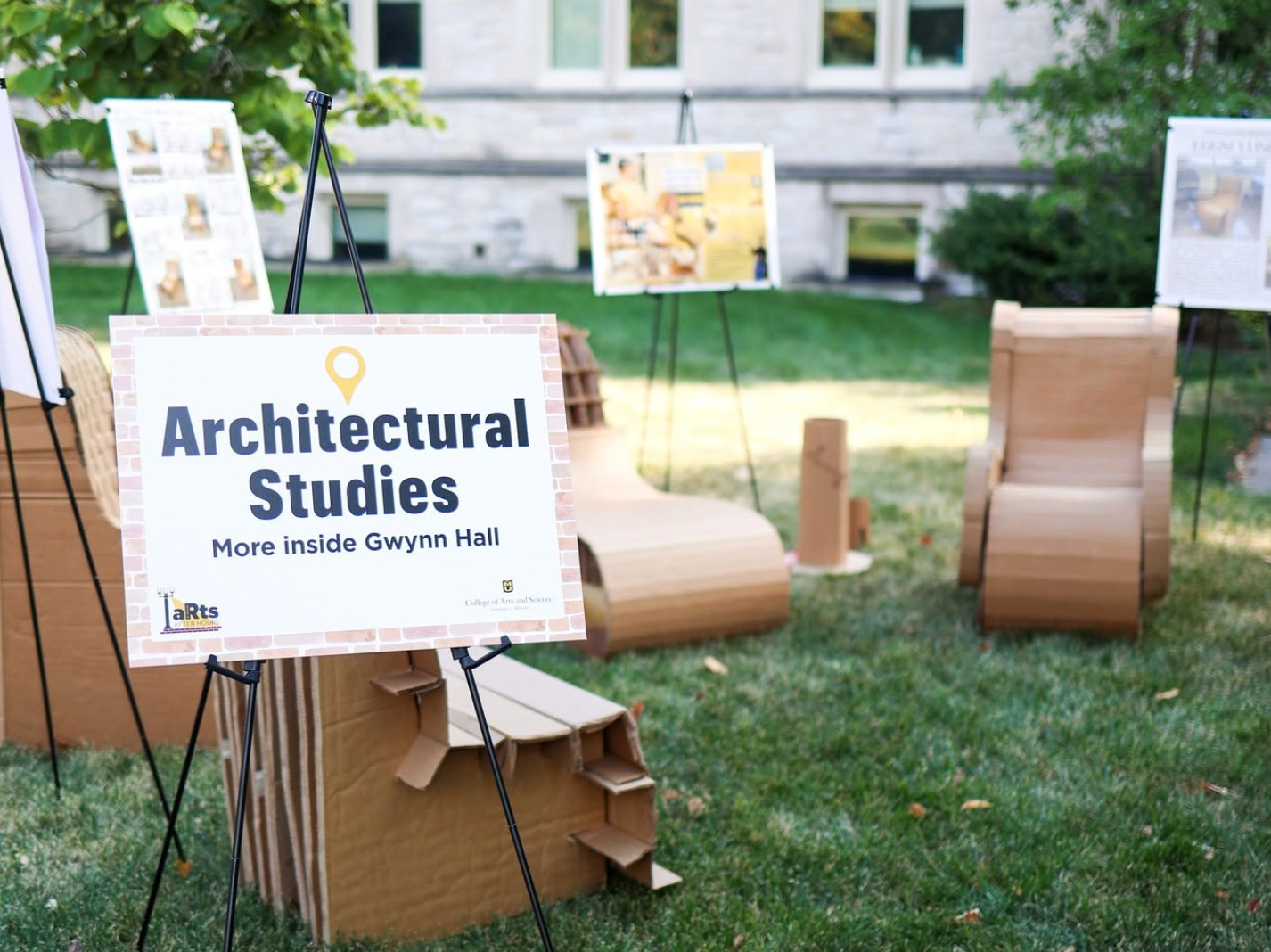 cardboard chairs made by arch studies students on the lawn in front of Stanley Hall