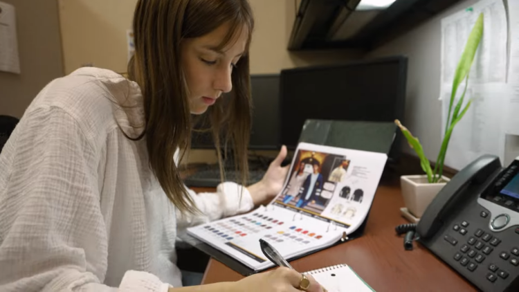 Cali Burns working at a desk
