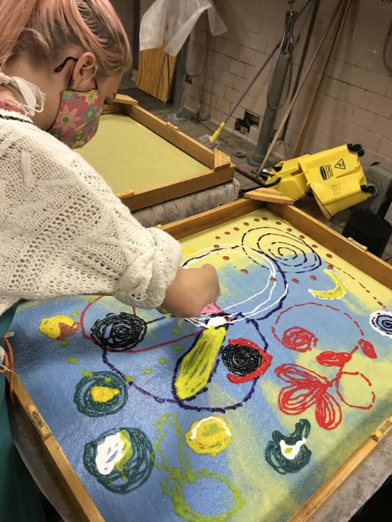 Student Making Art with Paper