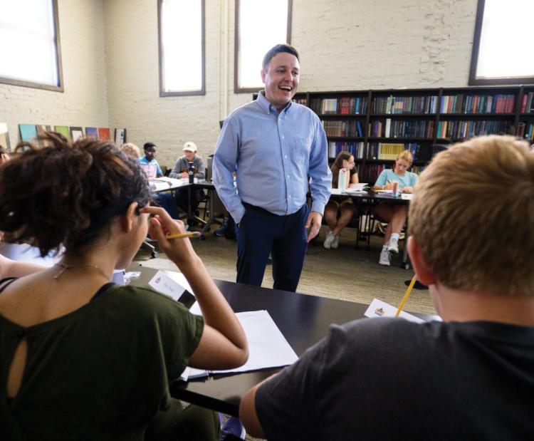 man inside circle of students