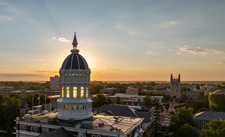 Jesse Hall with sunrise and campus beauty